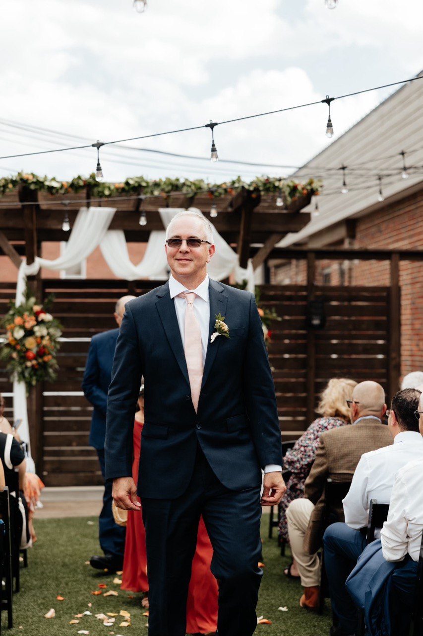 Alastair Fraser in a suit at an outdoor event